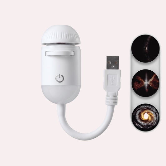 MelixTech Dream Projector, a white portable USB night light that projects galaxy and space patterns onto surfaces.
